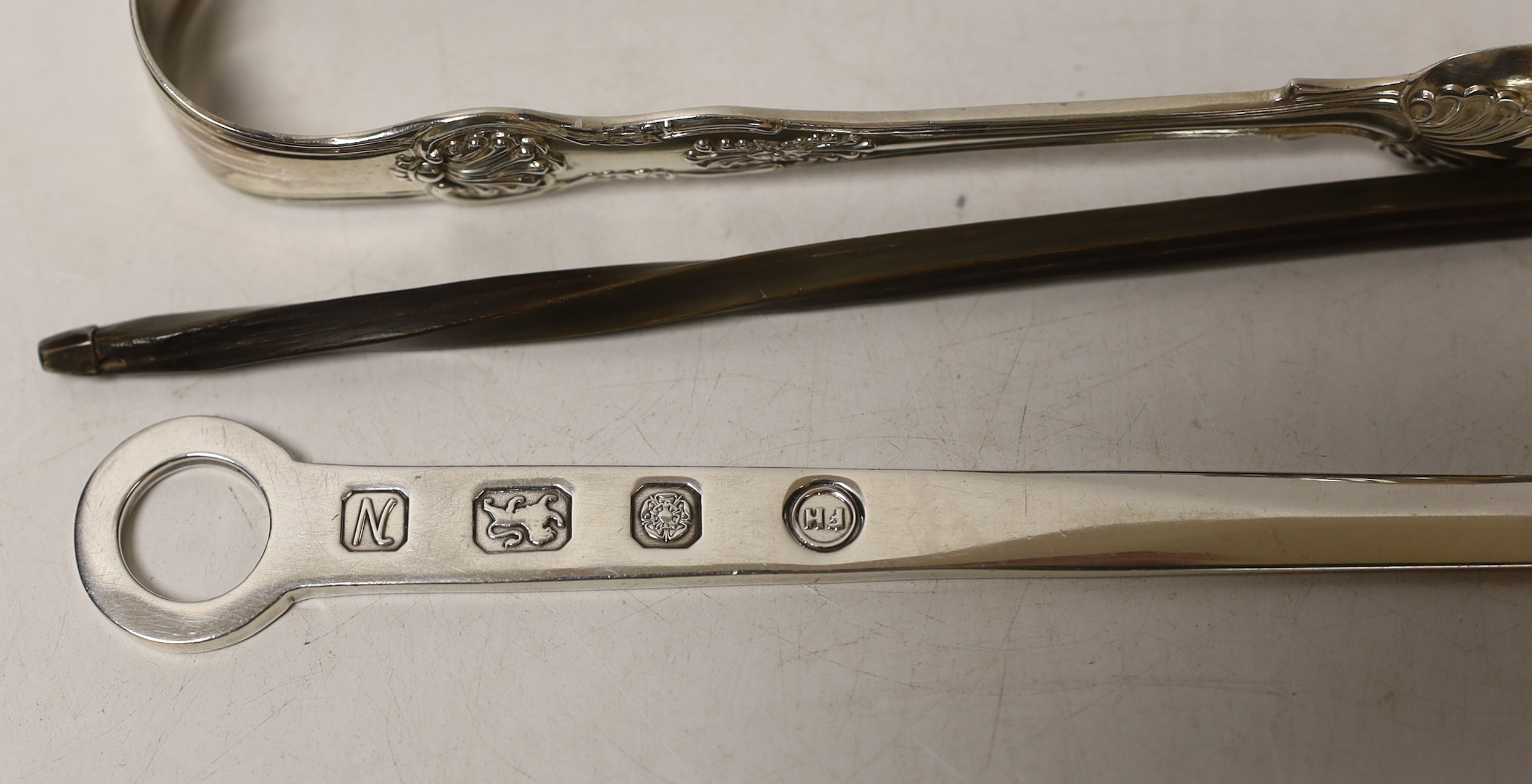 Two pairs of silver sugar tongs, including Victorian King's pattern a white metal toddy ladle and a modern silver letter opener.
